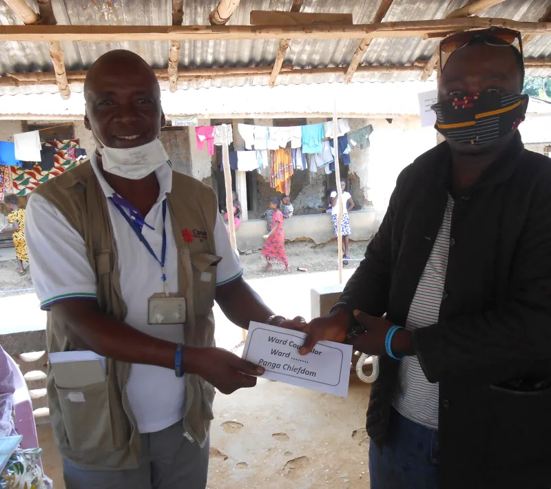tonny bangallie caritas bo rep. presenting the dsa to the collaborating partner ward councillor at makemuma information sharing meeting